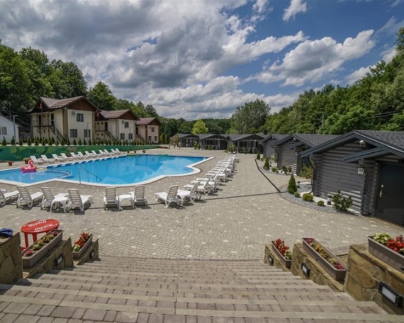 How do you heat a holiday resort with an outdoor pool?